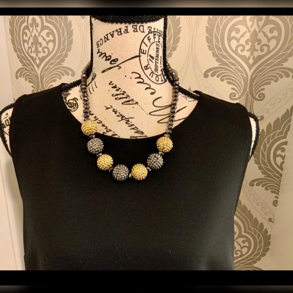 Mixed metals bauble style necklace.